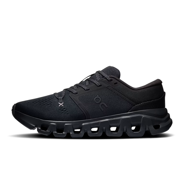 A black On running shoe with a chunky, hollowed-out sole, shown in a side profile on a white background.
