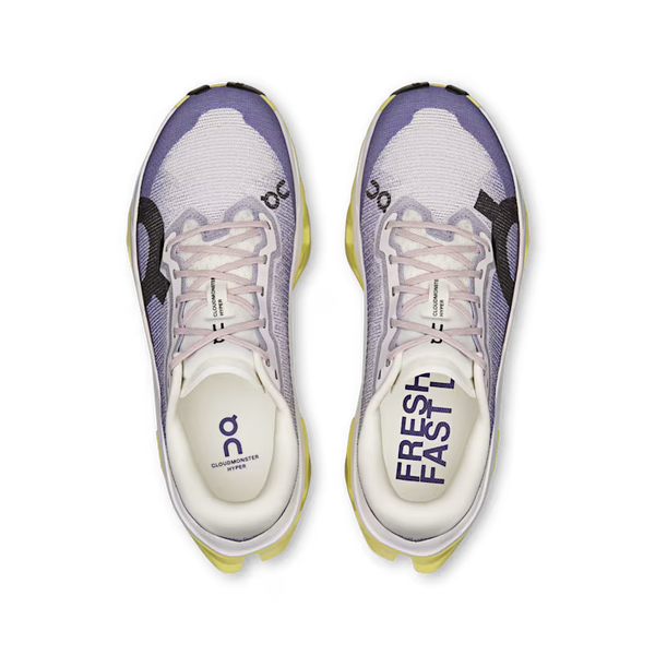 Pair of running shoes with purple and white design on a transparent background