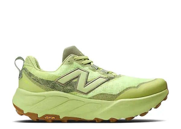 Lime green trail running shoe on a white background