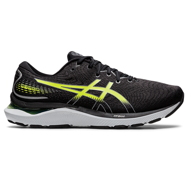 A pair of black Asics running shoes with green accents, featuring a mesh upper and a visible sole with various materials.