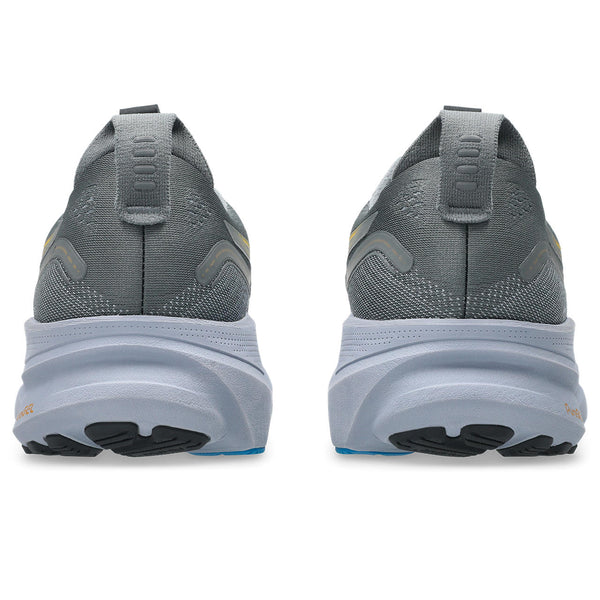 Gray running shoes with a white sole on a white background