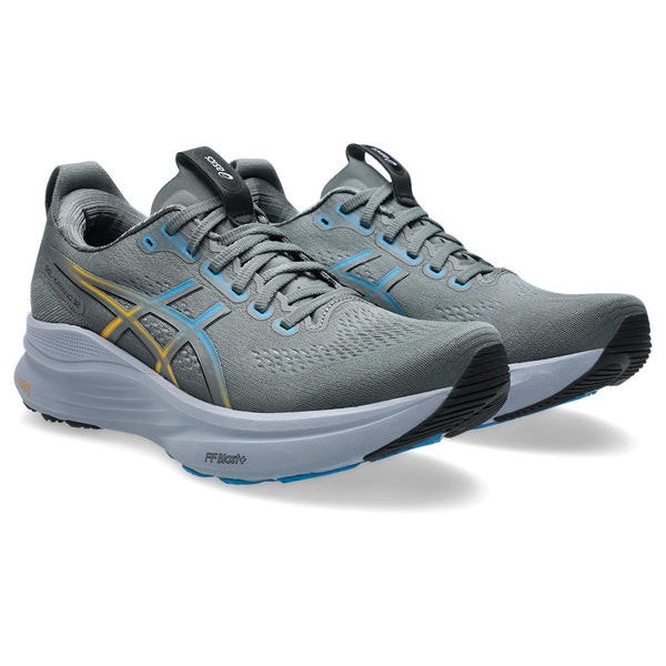 A pair of ASICS gray running shoes with blue accents on a white background.