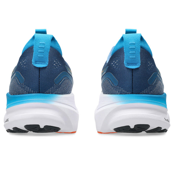 Blue running shoes with white soles on a white background