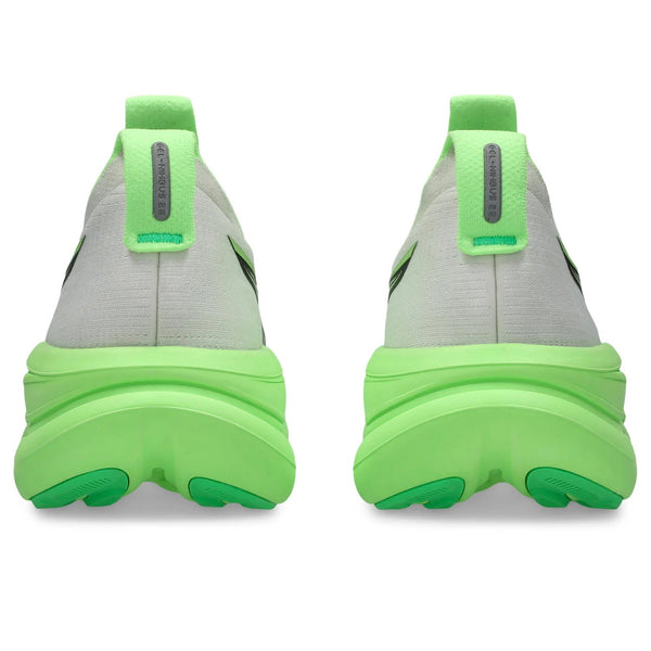Green and gray sneakers with a focus on sole design on a white background