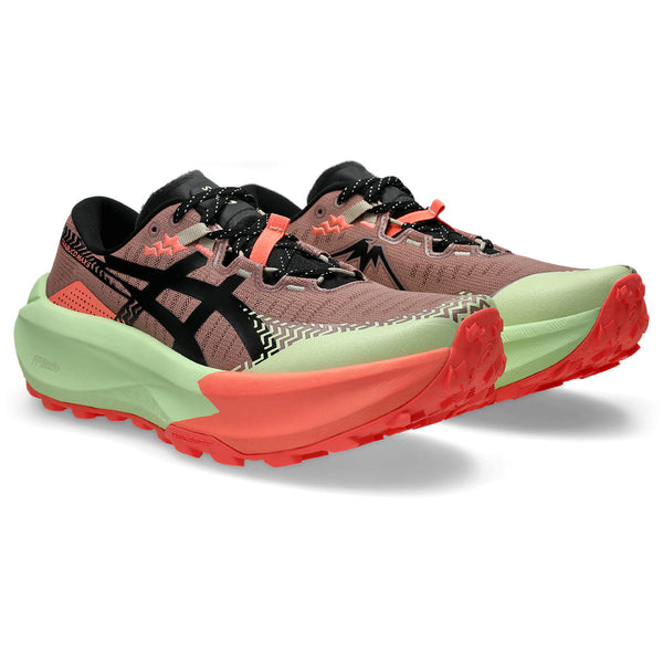 ASICS trail running shoes with green, red, and black design on a white background