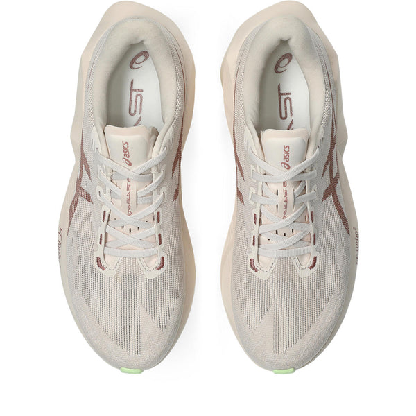 A pair of rose colored ASICS men's running shoes.