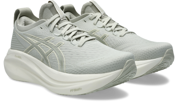 Light gray running shoes with a brand logo on a white background