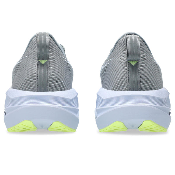 The heel area is the focus on these gray running shoes with white soles and green accents on a white background.