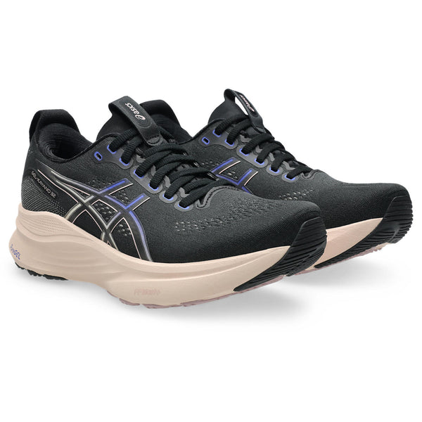 Black running shoes with beige soles on a white background