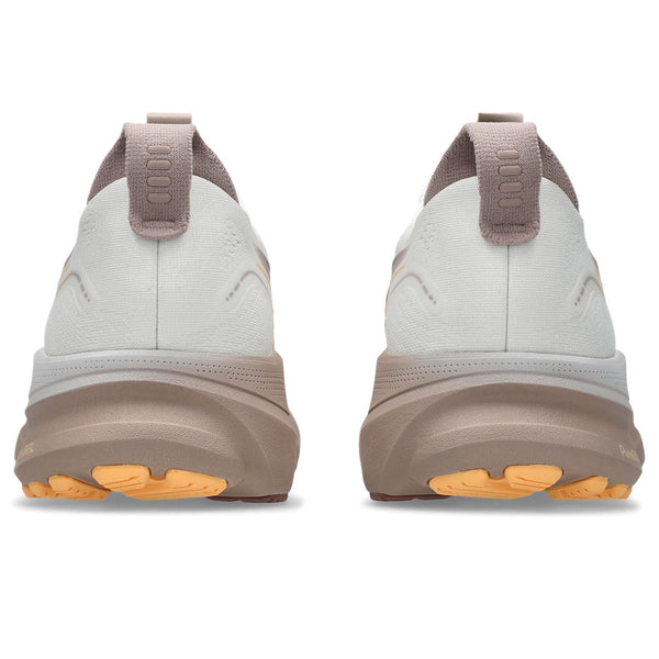 White and brown shoes with orange sole on a white background.
