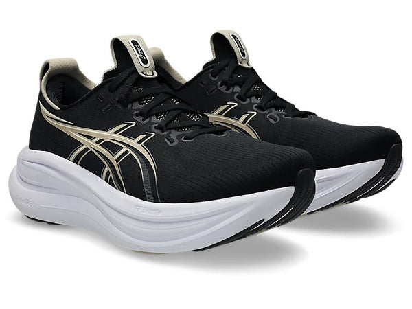 Black running shoes with white soles on a white background
