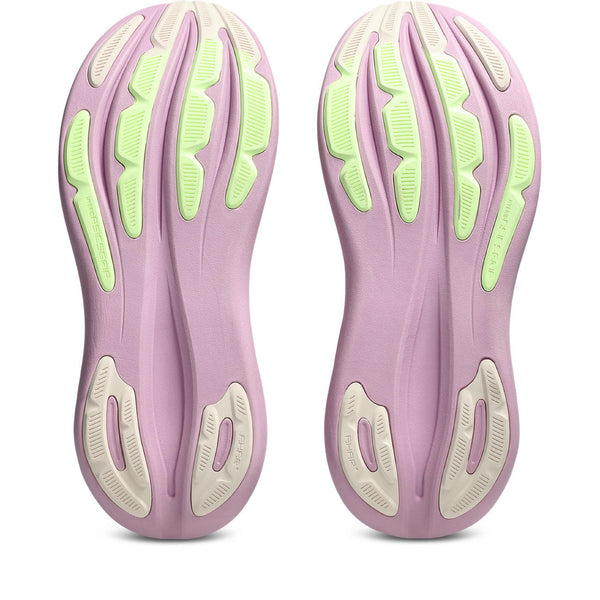 Purple and green shoe soles on a white background