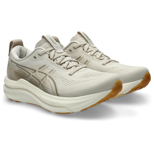 A tan ASICS logo is in the middle of the upper on both sides.
