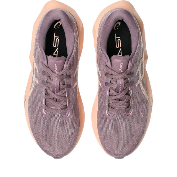 Purple running shoe with a beige sole on a white background