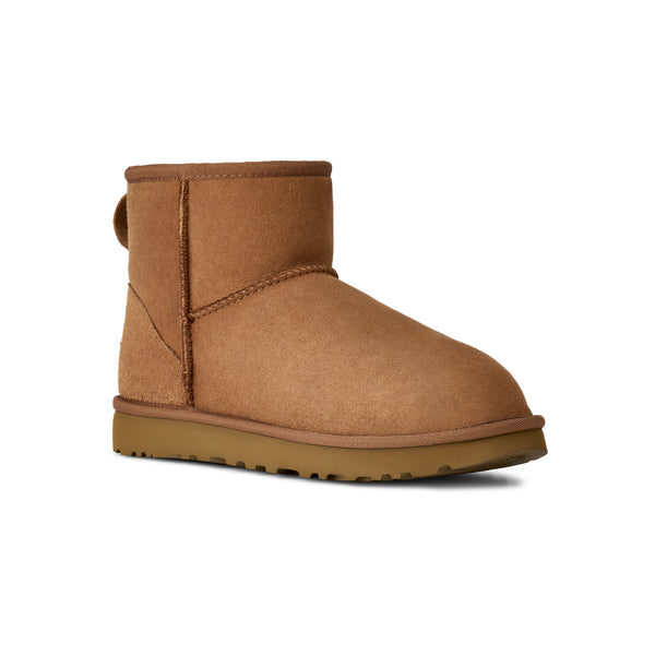 Tan lower calf length boot on a white background