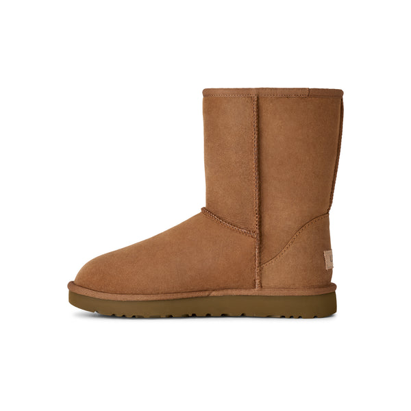 Calf height tan slipper boot on a white background
