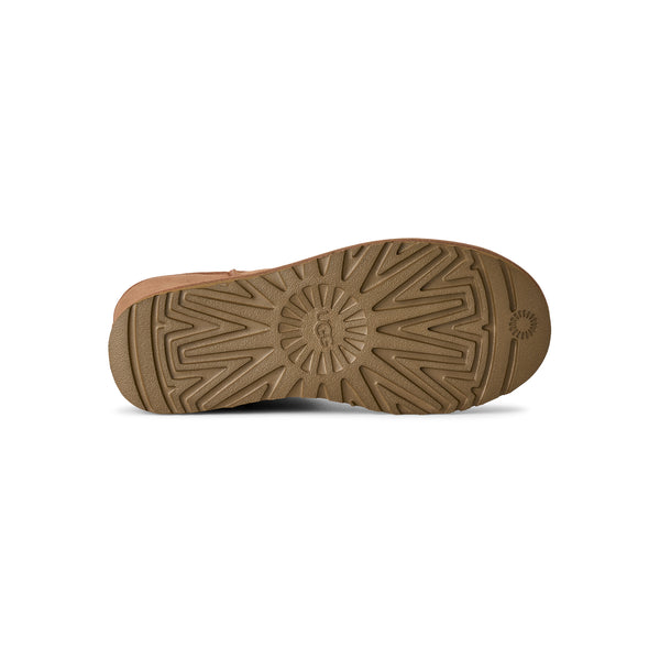 Calf height tan slipper boot on a white background