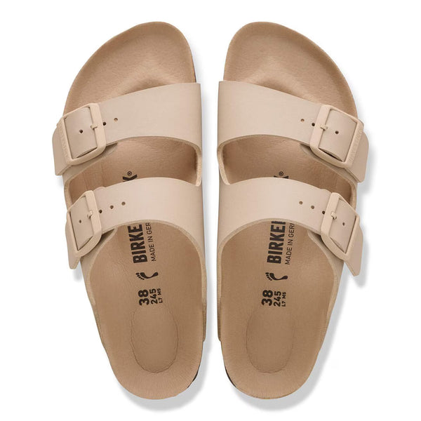 Tan 2 strap sandal on a white background