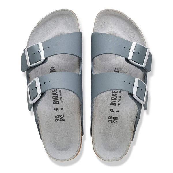 Slate grey sandal with a cork midsole on a white background
