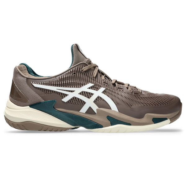 Brown and white tennis shoe with white and green accents on a white background.