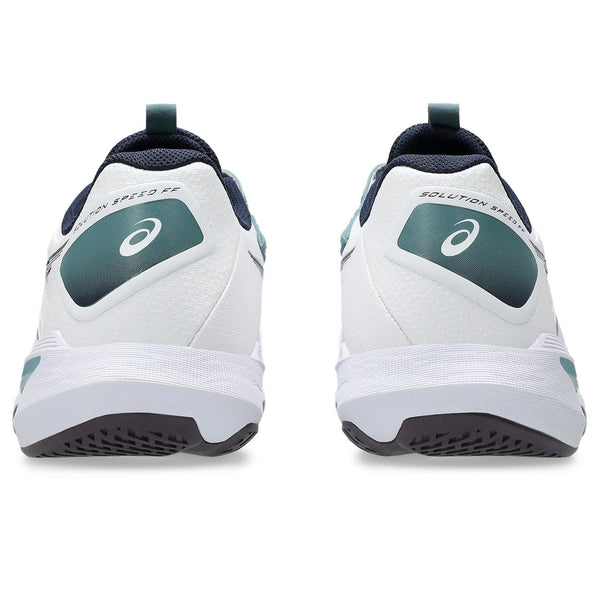White running shoes with green accents on a white background
