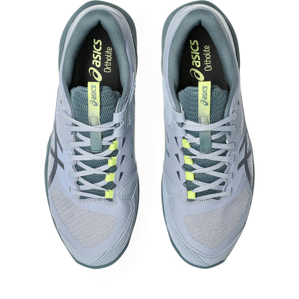 Pair of gray and green Tennis shoes with green accents on a white background