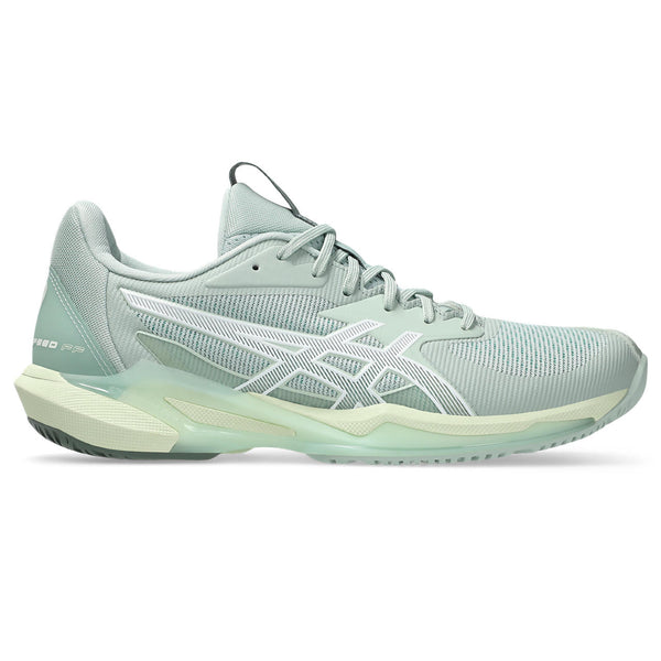 Light blue running shoe on a white background and a low profile stance.