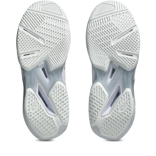 Close-up of white athletic shoes with tread pattern on a white background