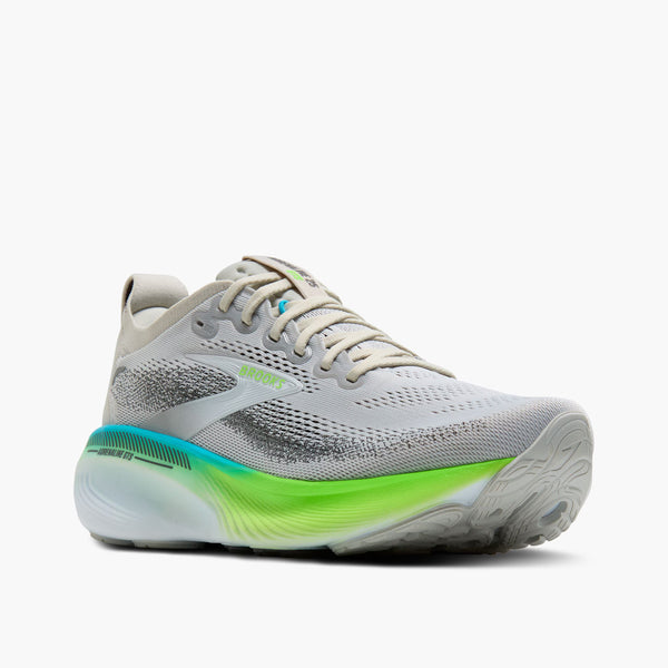 A men's Brooks running shoe with grey laces adn a grey upper.