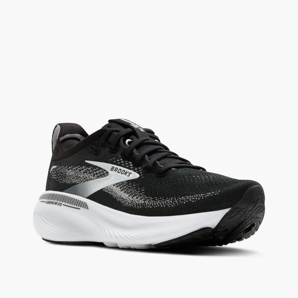 Black running shoe with white sole on a white background