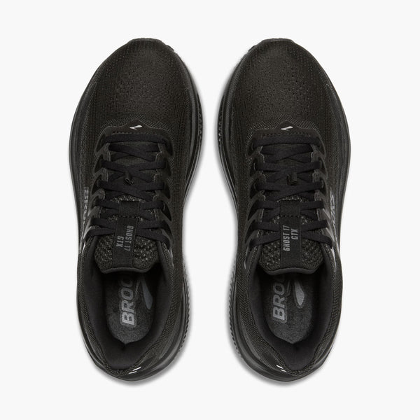 Black running shoes with visible branding on a white background