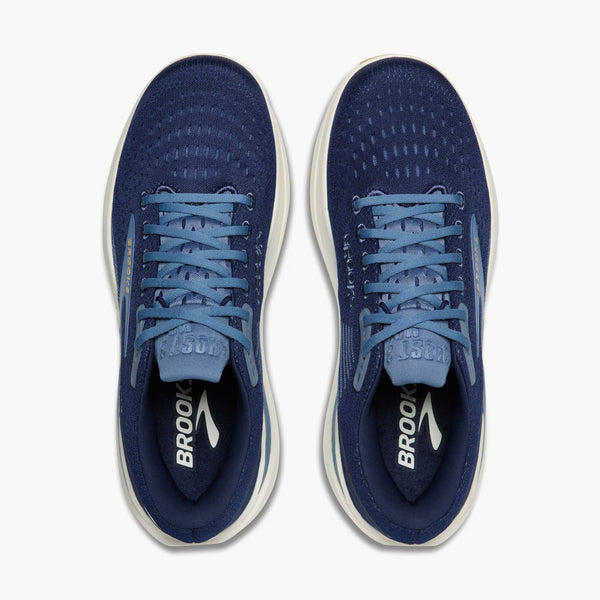 Pair of blue running shoes with white soles on a white background