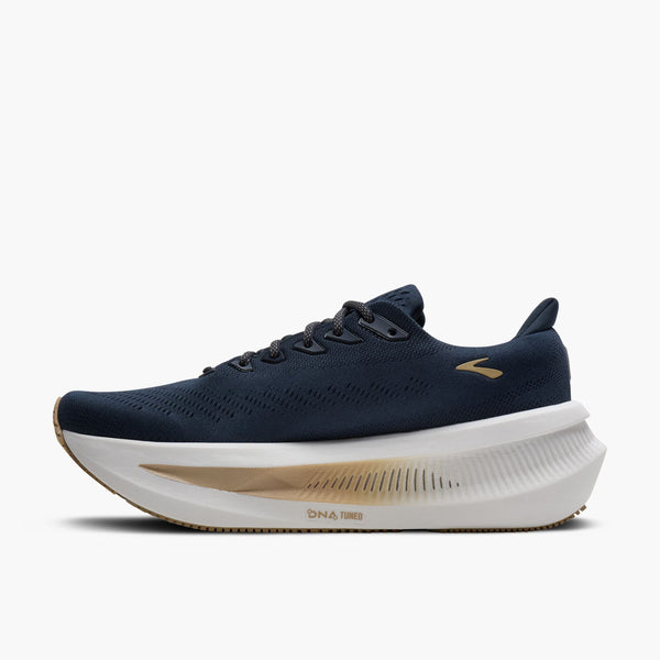 The medial side of this navy running shoe with white sole on a white background