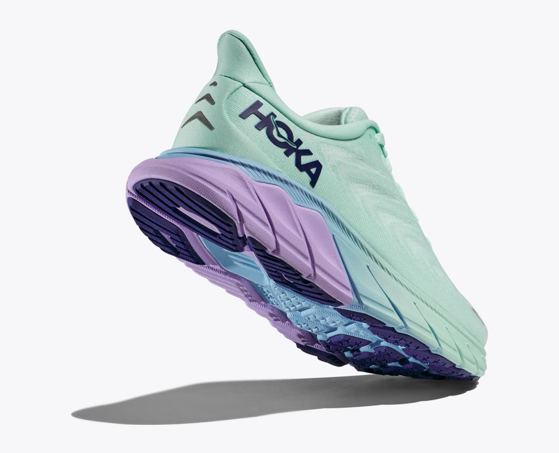 Back angle view of the Women's Arahi 6 by HOKA in the color Sunlit Ocean/Lilac Mist