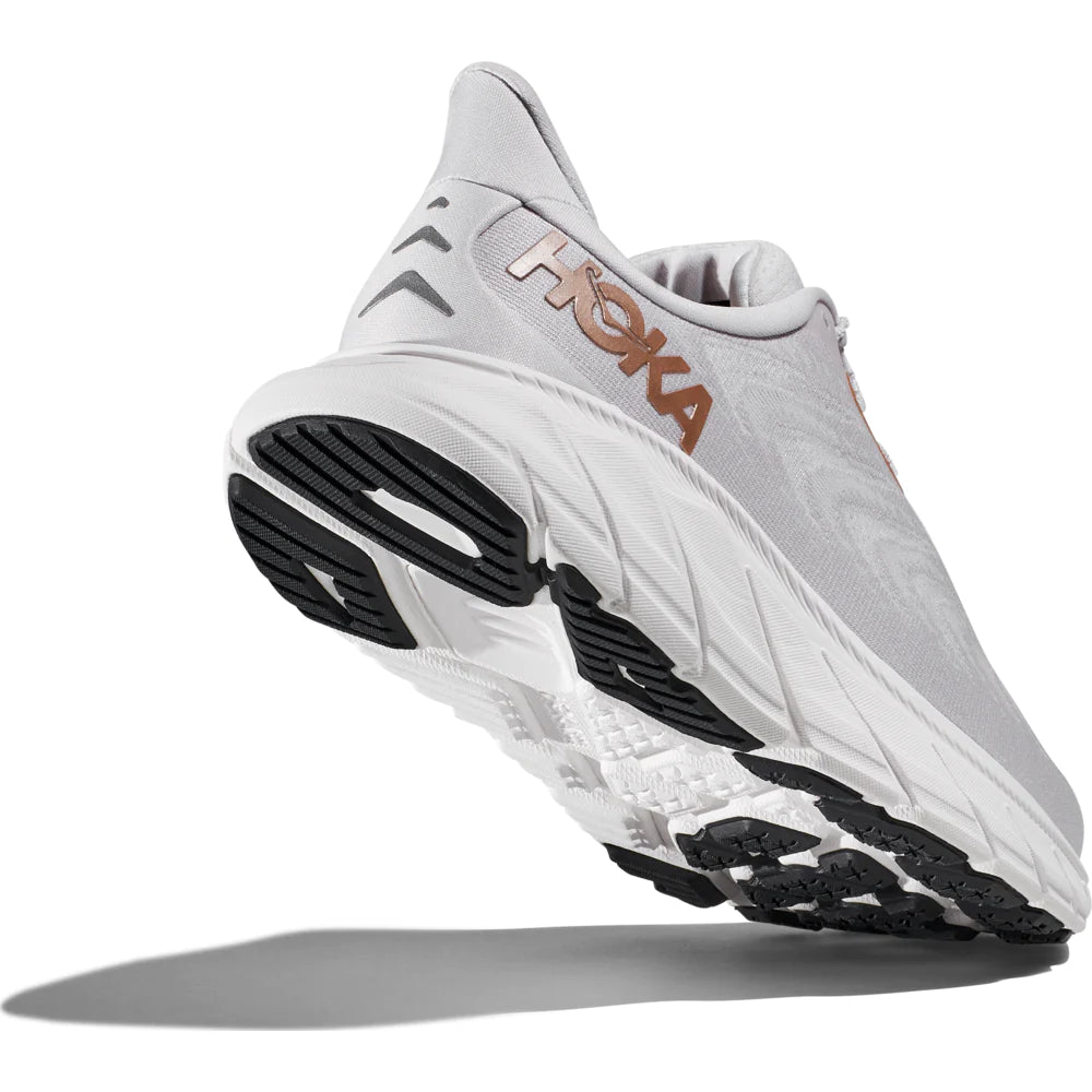 Back angle view of the Women's Arahi 6 in the wide D width, color Nimbus Cloud/Rose Gold