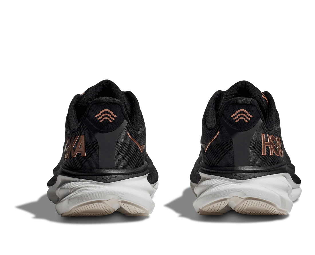 Back view of the Women's Clifton 9 by HOKA in Black/Copper