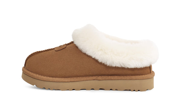 Sherling and tan slipper on a white background