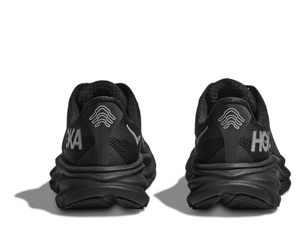 The heel area has a small Hoka logo on the medial side of the shoe.