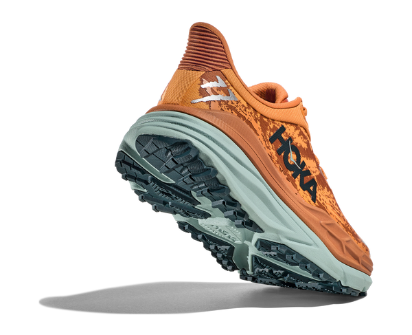 Back angle view of the Men's Stinson 7 in the color Amber Haze/Amber Brown