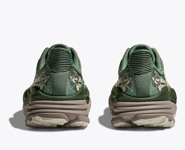 Green sneakers with textured design on a white background
