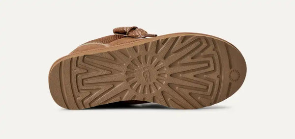 Tan sneaker with sherpa lining on a white background