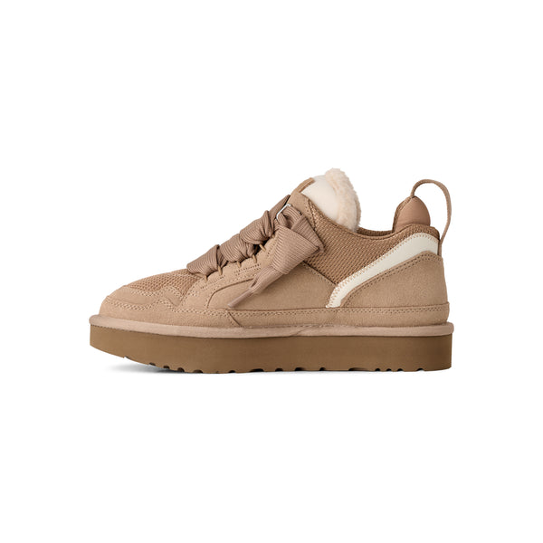 Light tan sneakers on a white background