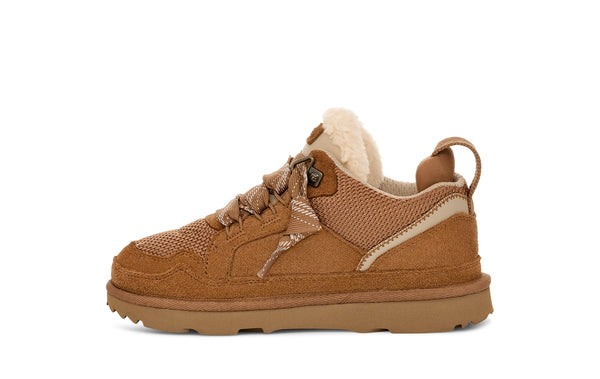 Kids tan sneaker on a white background