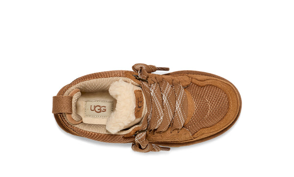 Kids tan sneaker on a white background