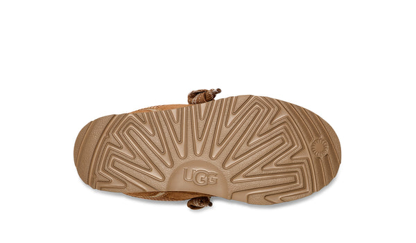 Kids tan sneaker on a white background