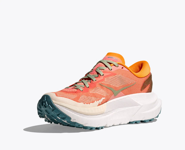 Coral colored trail unning shoe with green and white accents on a light gray background