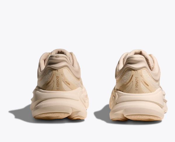 Beige sneakers with a brand logo on a white background