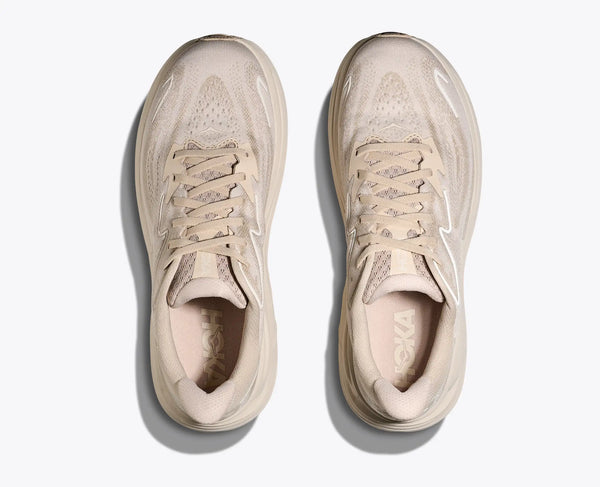 Pair of beige sneakers on a white background