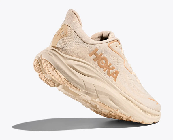 Beige running shoe with 'Hoka' branding on a white background