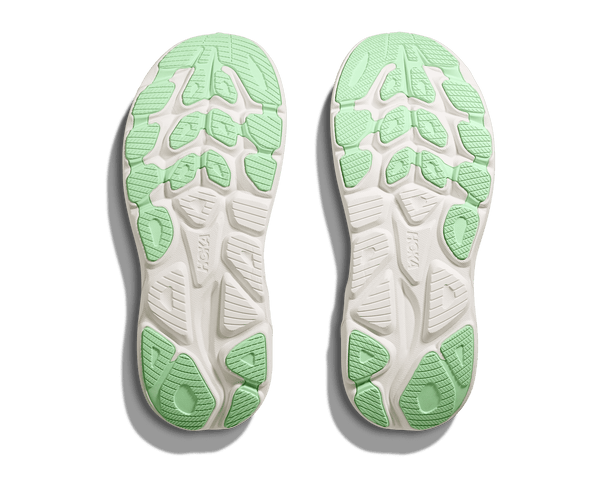 Lime green rubber is used on the outsole of the shoe to contrast the white midsole.
